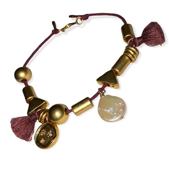 Adjustable bracelet with gold tone beads and mother of pearl accent With tassels - Picture 1 of 2